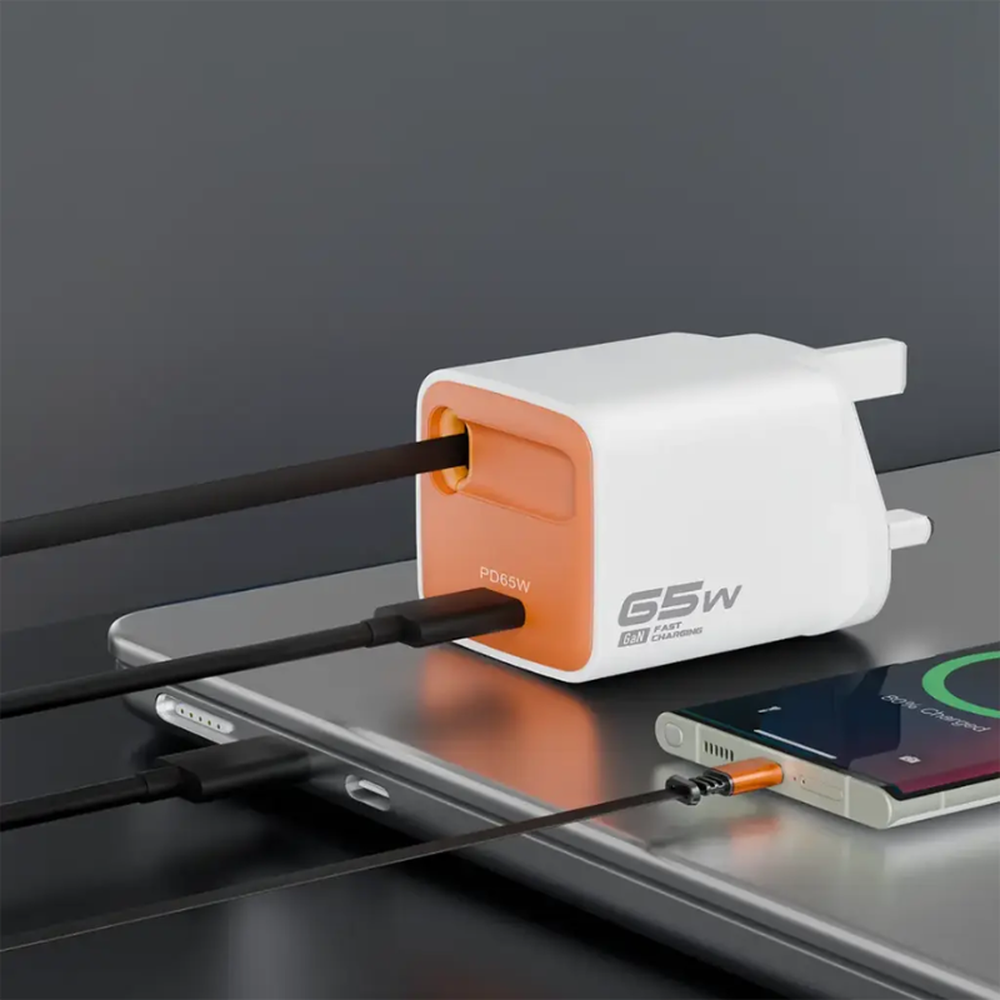 White Porodo 65W GaN wall charger with retractable USB-C cable charging phone