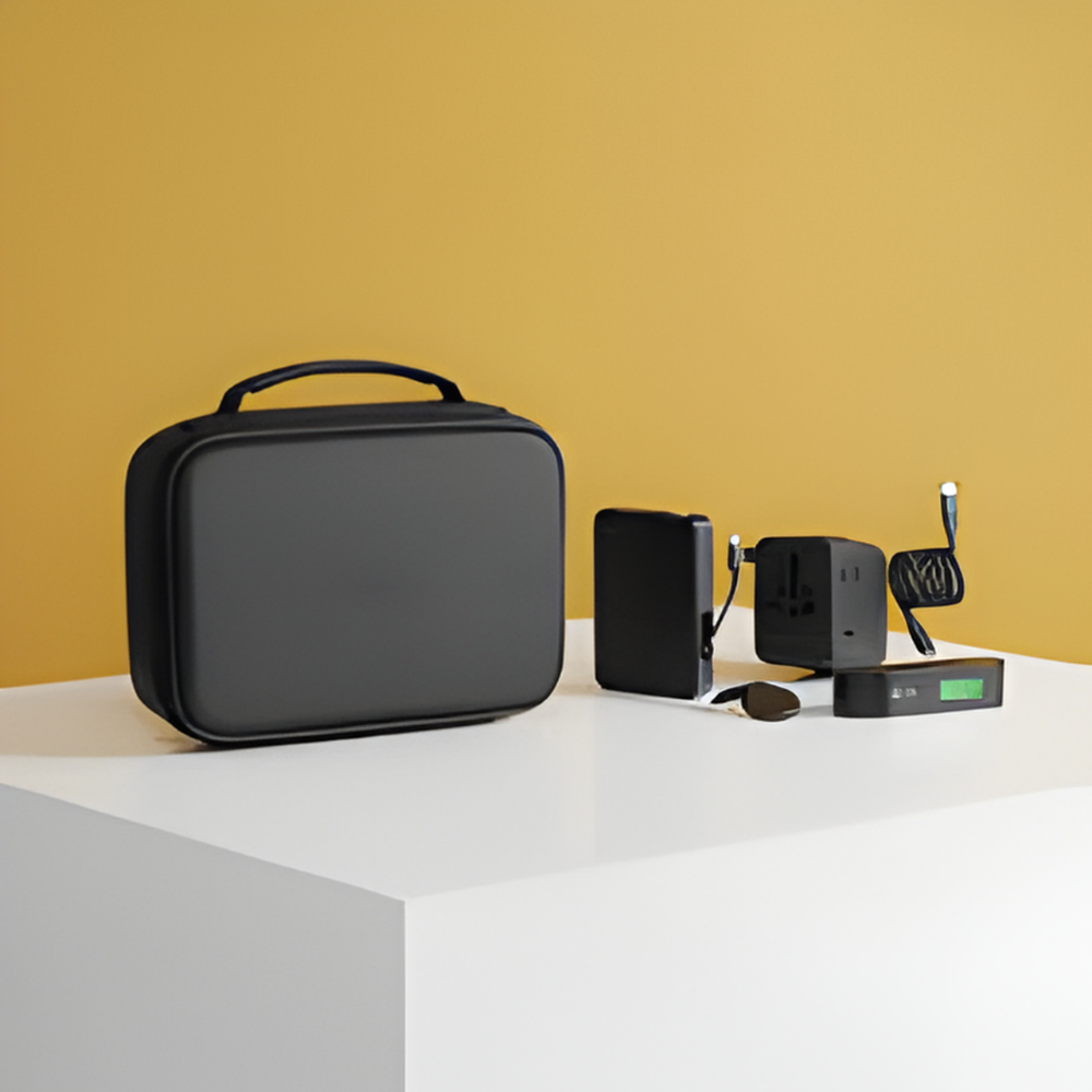 Black Momax travel kit components including 35W adapter and 10000mAh power bank on yellow background