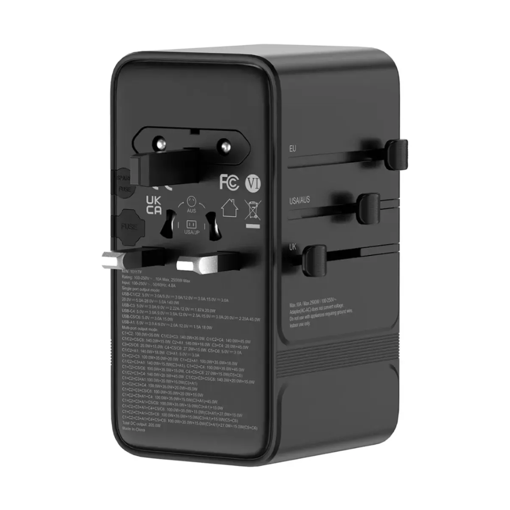 Side profile of compact black travel adapter with retractable plug heads