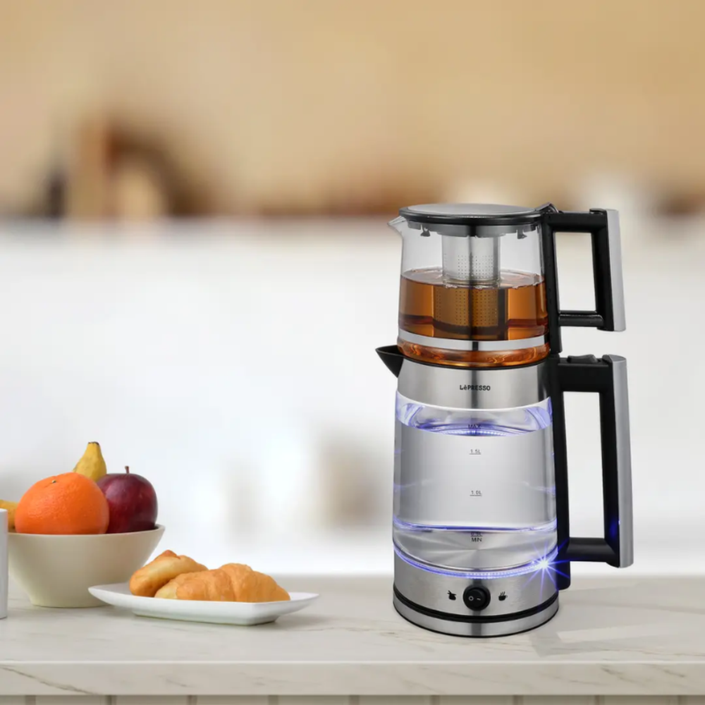 LePresso electric Turkish tea maker with glowing blue ring on marble counter with breakfast