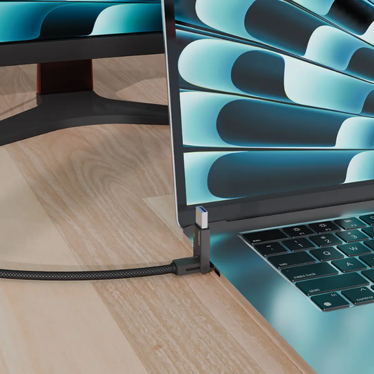 Powerology multi-port adapter plugged into silver laptop for data transfer