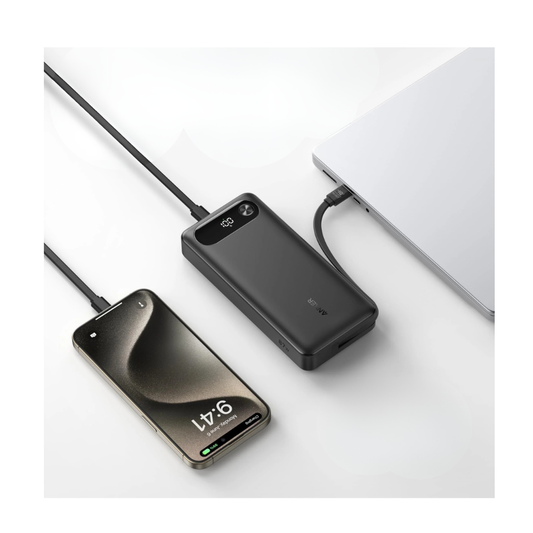 Anker 65W power bank with built-in USB-C cable charging laptop and smartphone