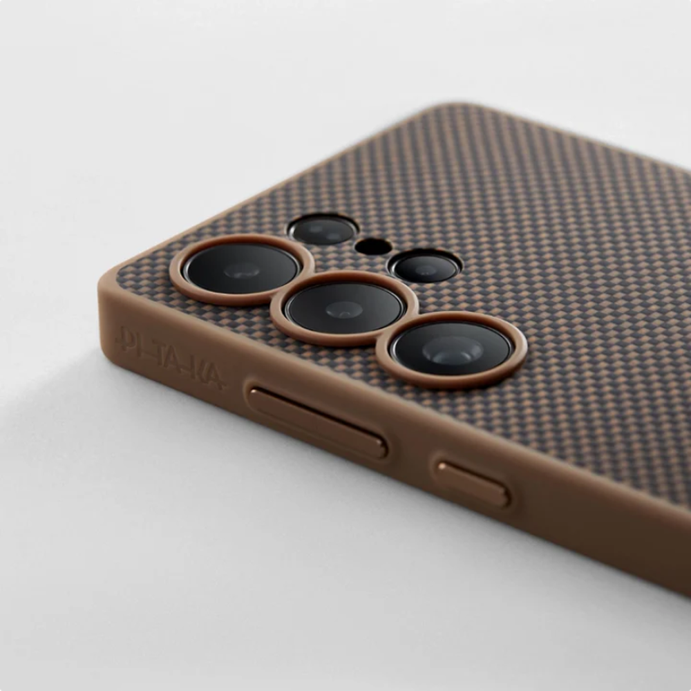 Pitaka S25 case corner detail showing carbon fiber pattern and triple lens cutout