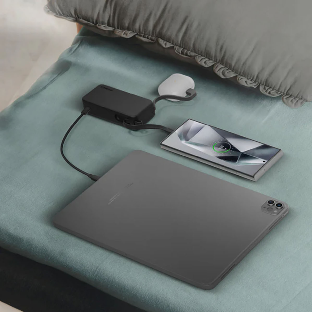 Momax fast charging power bank simultaneously powering tablet and phone