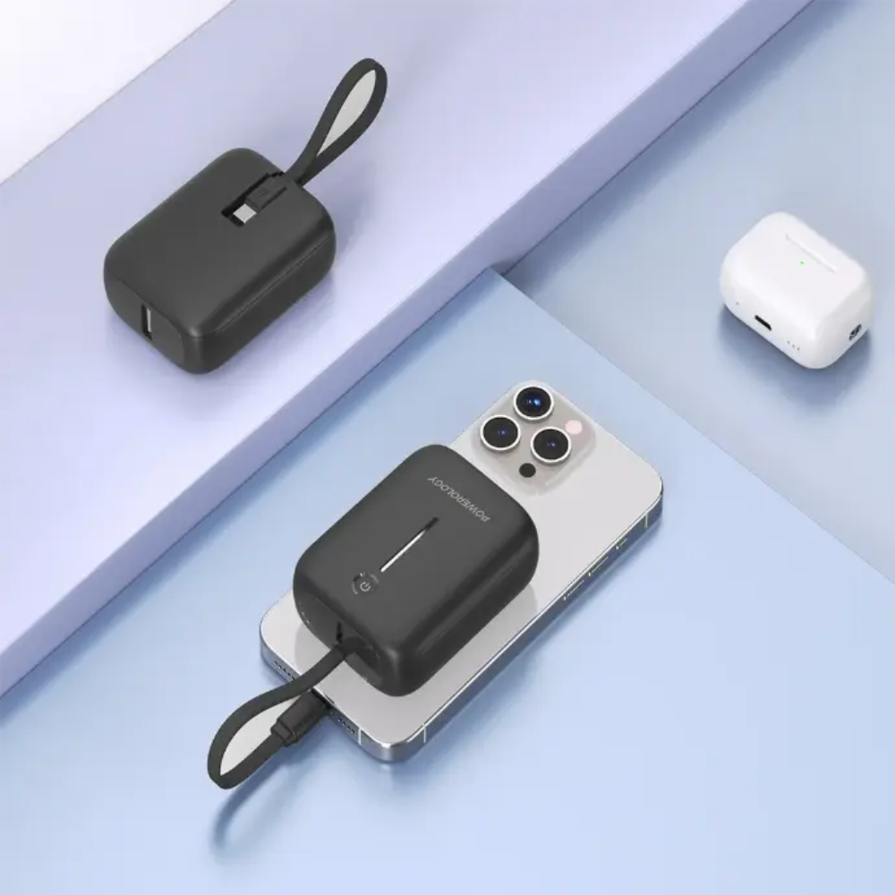 Black Powerology power bank charging smartphone via built-in USB-C cable
