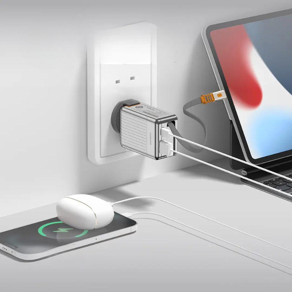 Dual-port Porodo 42W GaN charger powering tablet and smartphone in wall socket