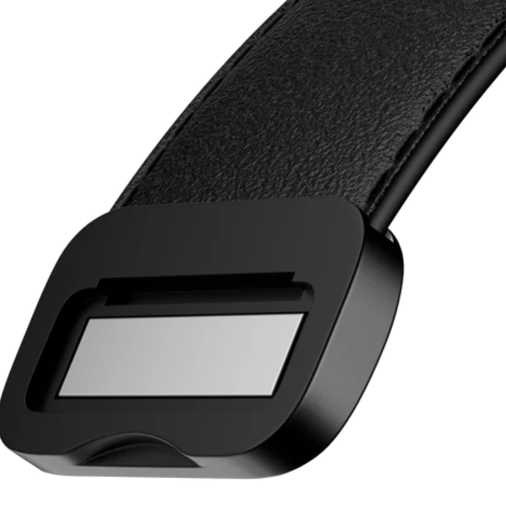 Close-up of matte black magnetic clasp mechanism on leather watch band