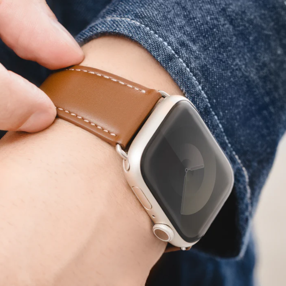 Brown leather Apple Watch band on wrist demonstrating comfortable daily wear