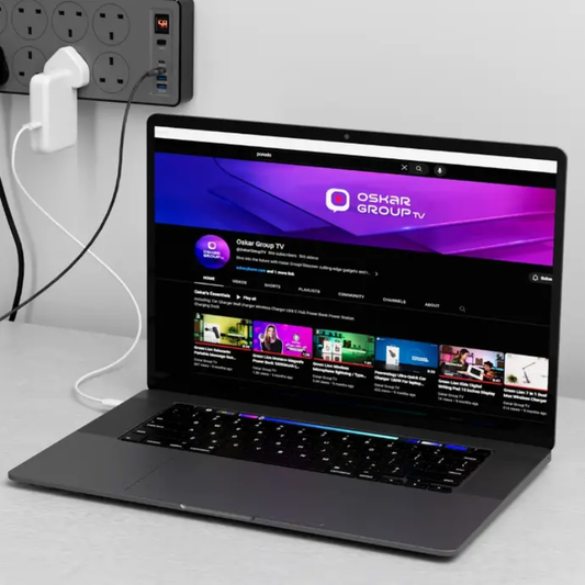 Powerology 2990W power strip with UK outlets powering laptop and devices on desk