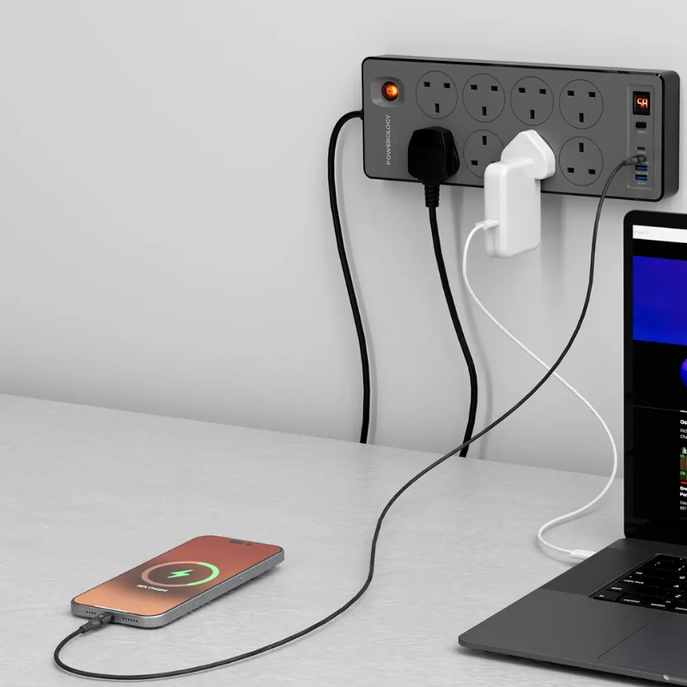 Black Powerology power strip with timer display charging smartphone and laptop