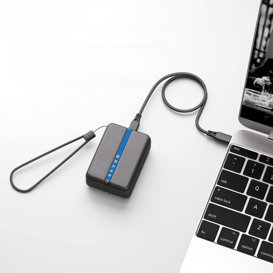 Black Brave 65W PowerBank with wrist strap charging laptop