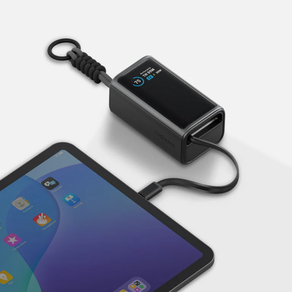 Black Energea power bank charging tablet via built-in USB-C cable