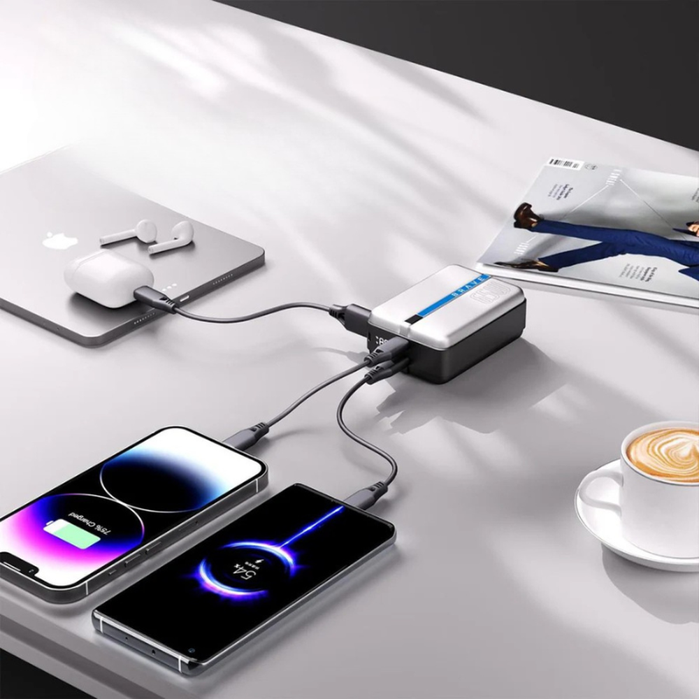 Brave 65W PowerBank simultaneously charging laptop and phones