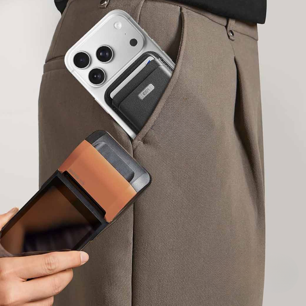 Black ESR Geo MagSafe wallet on brown trousers with silver label and card slots