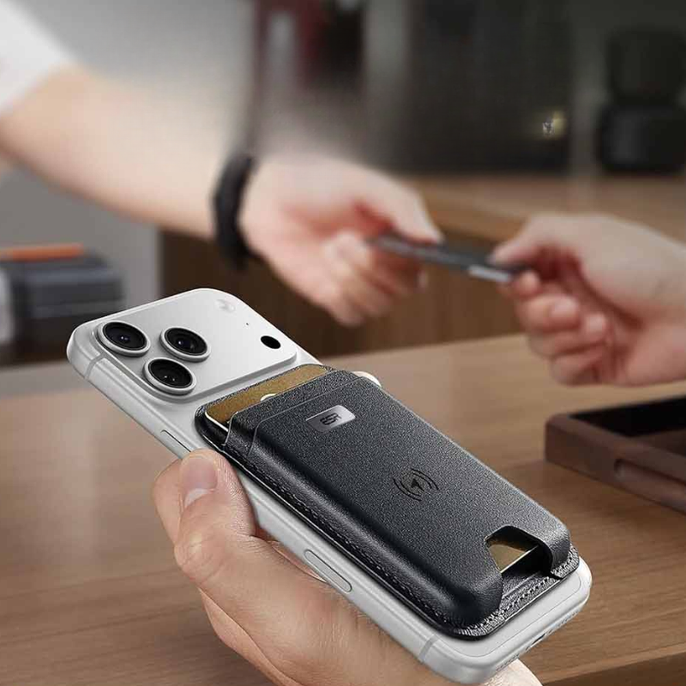 Black leather ESR MagSafe wallet on silver phone showing wireless charging symbol