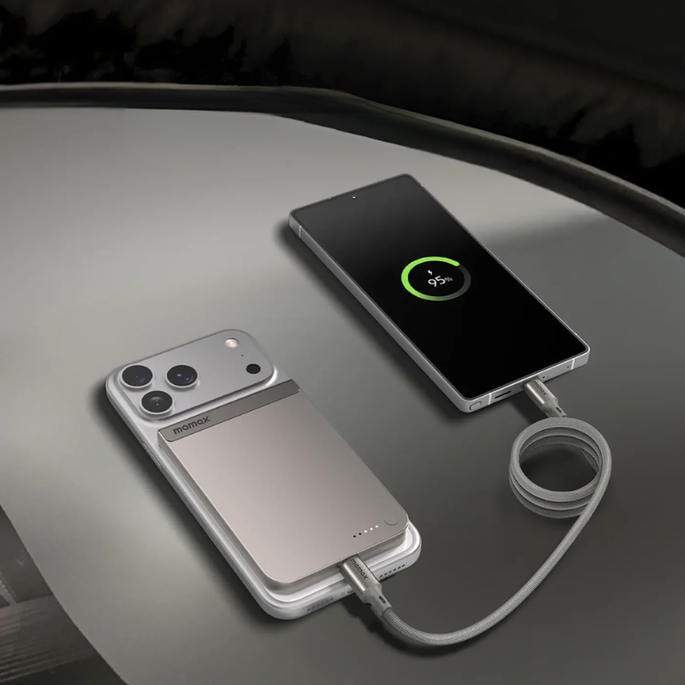 Silver braided cable connecting two phones via magnetic power bank