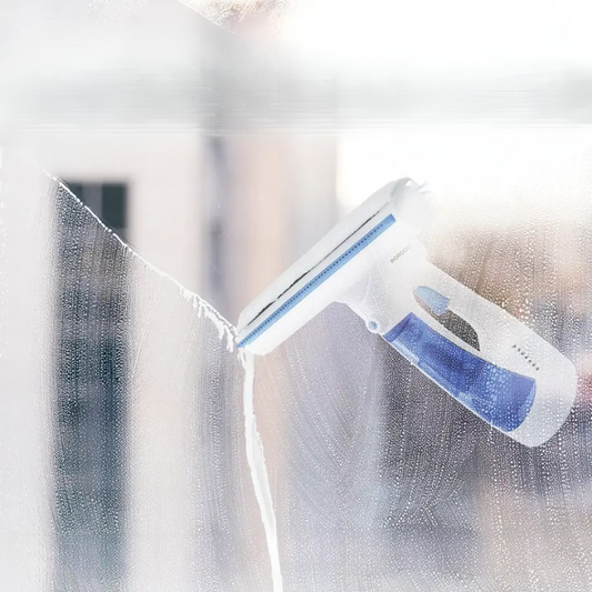 Porodo cordless window cleaner spraying and wiping soapy glass with microfiber squeegee