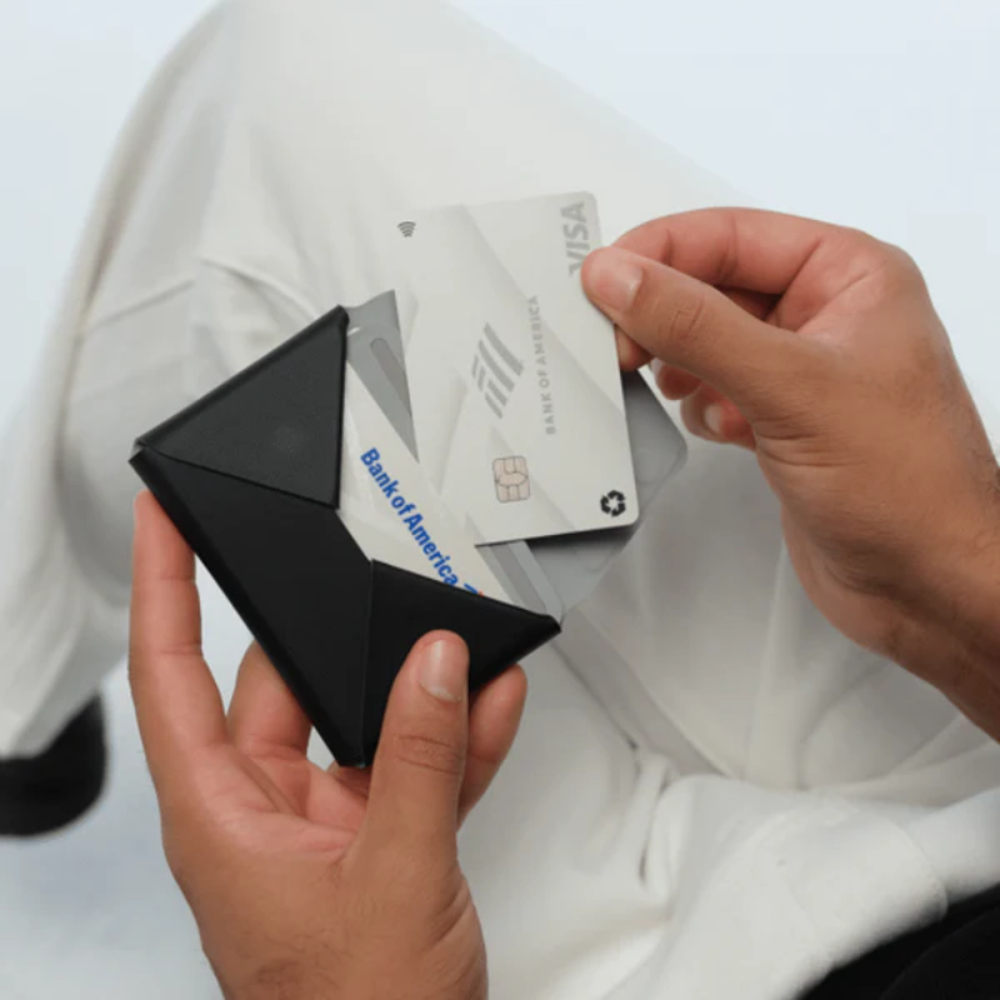 Black Moft wallet open showing card slots and chip card