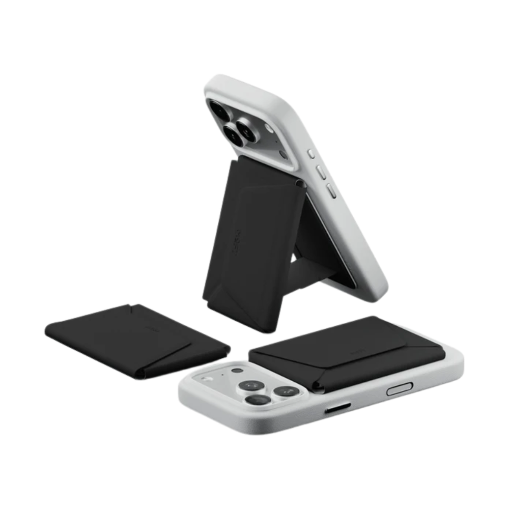 Black Moft wallet attached to phone as foldable stand