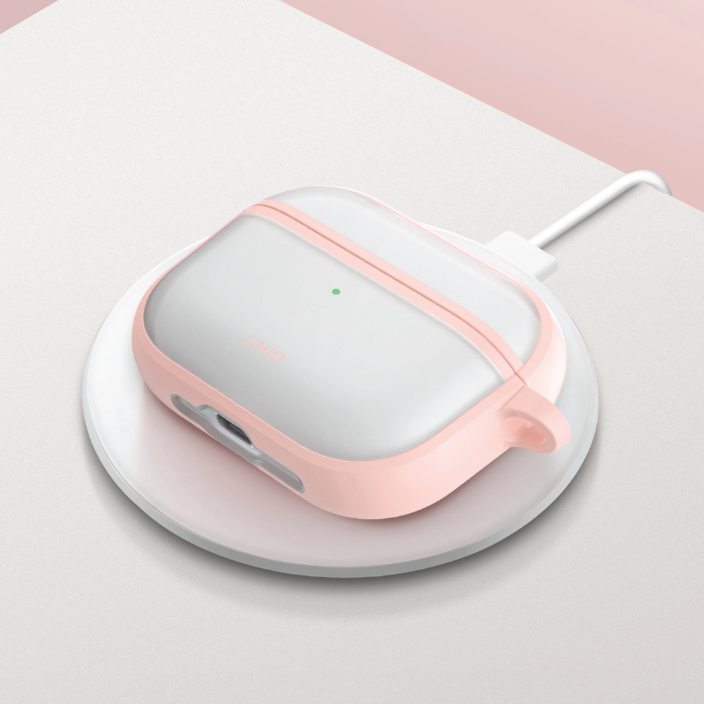 Pink UNIQ AirPods Pro 3 case on wireless charging pad with green LED light