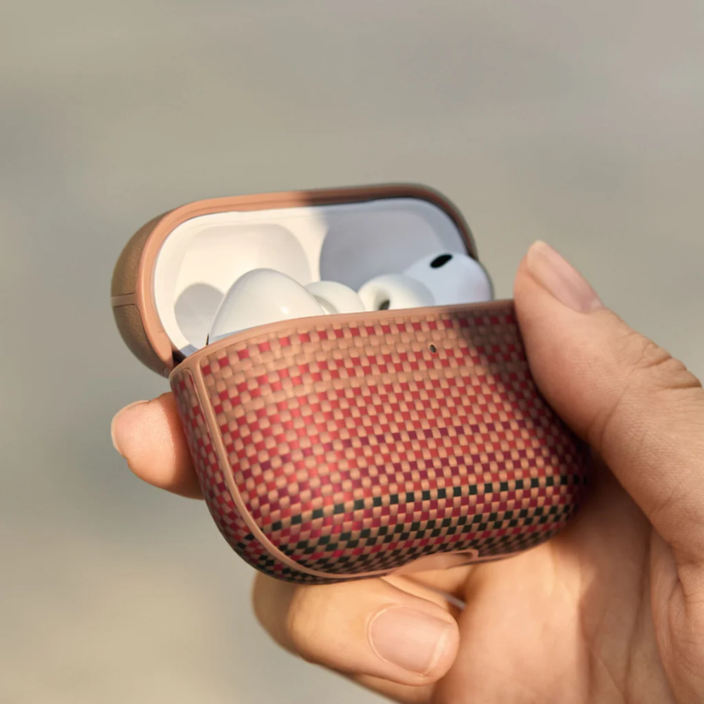 Hand holding open tan Pitaka AirPods Pro 3 case to show size and fit