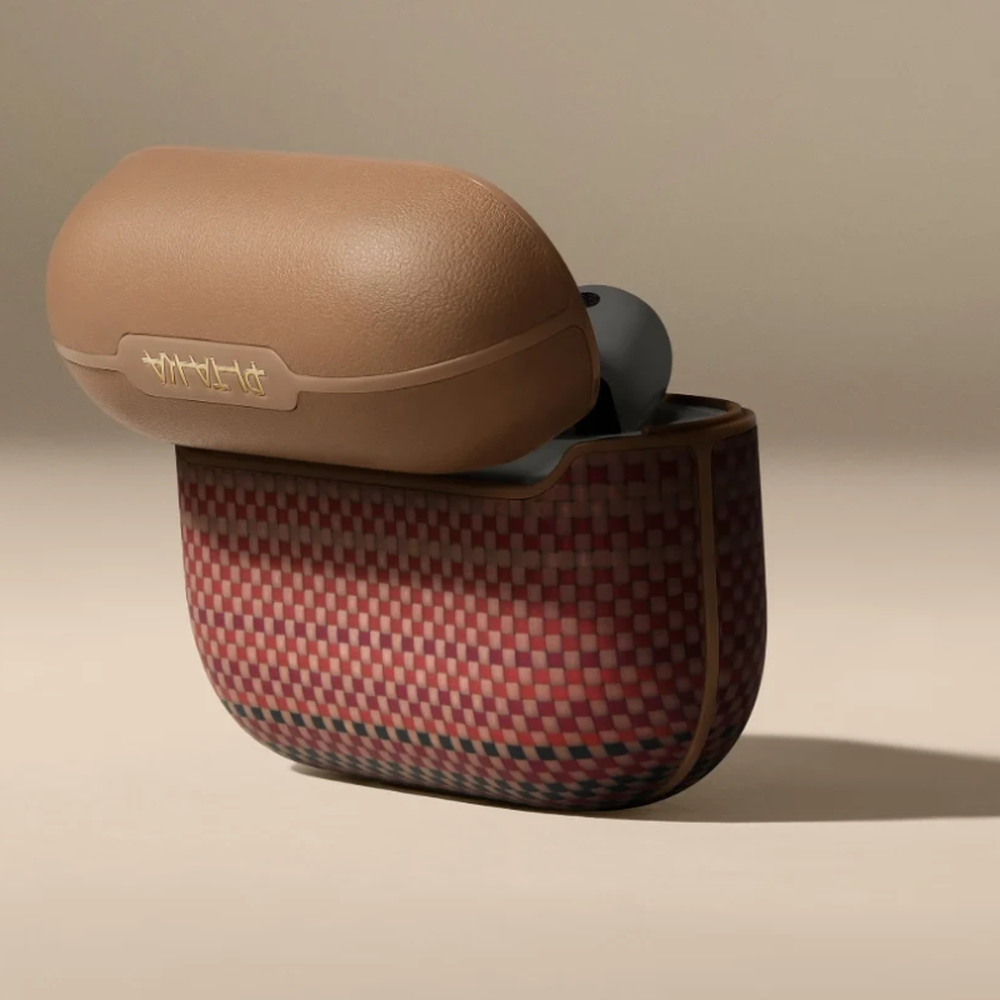 Tan Pitaka AirPods Pro 3 case showing pebbled lid and multicolor woven base