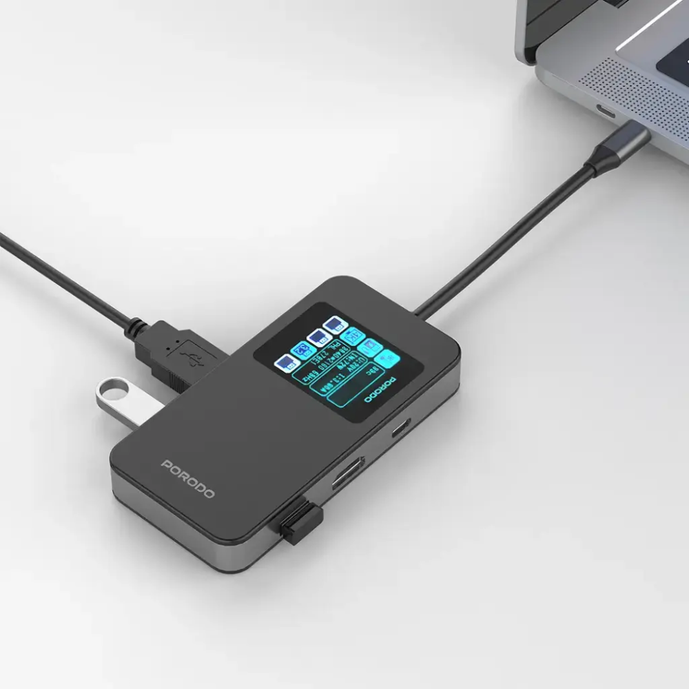 Porodo USB-C hub connected to laptop and monitor with flash drive inserted