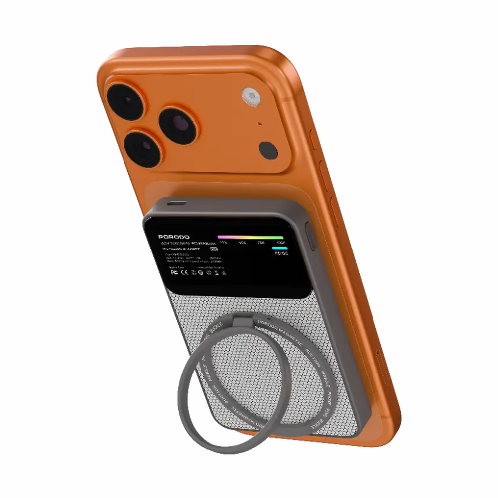Orange phone magnetically attached to black Porodo 20W magnetic power bank with honeycomb texture and LED display
