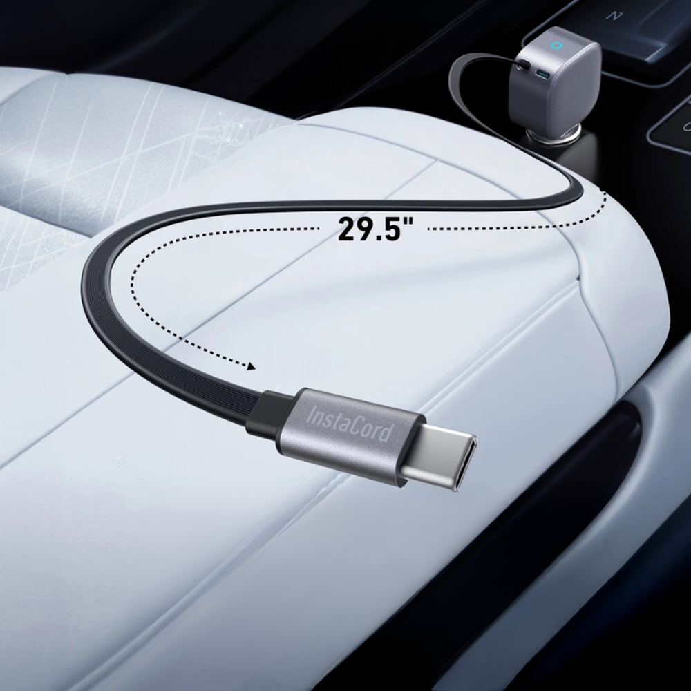 Close-up of black Anker InstaCord retractable USB-C cable plugged into car socket