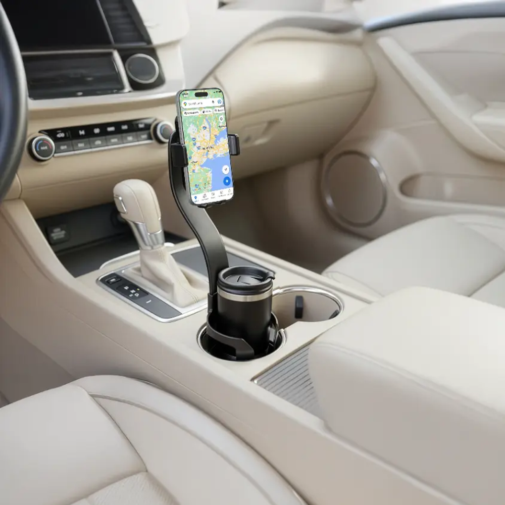 Green Lion car cup holder mount securing phone for navigation in beige vehicle interior