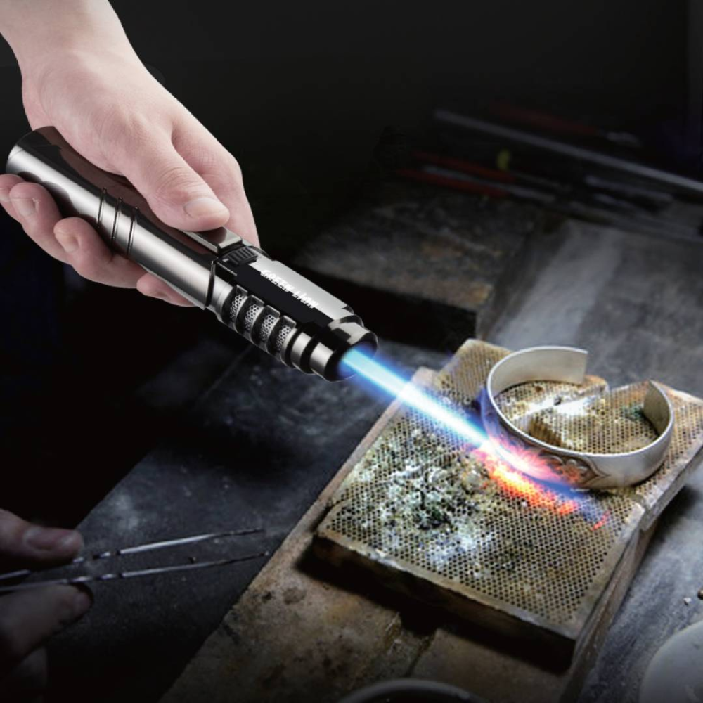 Green Lion jet lighter adjustable flame heating metal bracelet in workshop