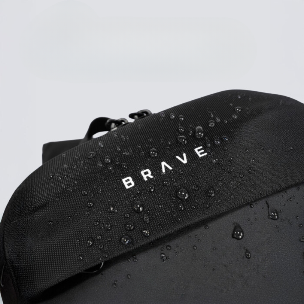 Close-up of water-resistant ballistic nylon texture on black Brave sling bag
