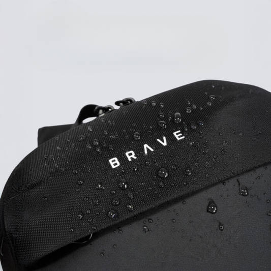 Close-up of water-resistant ballistic nylon texture on black Brave sling bag