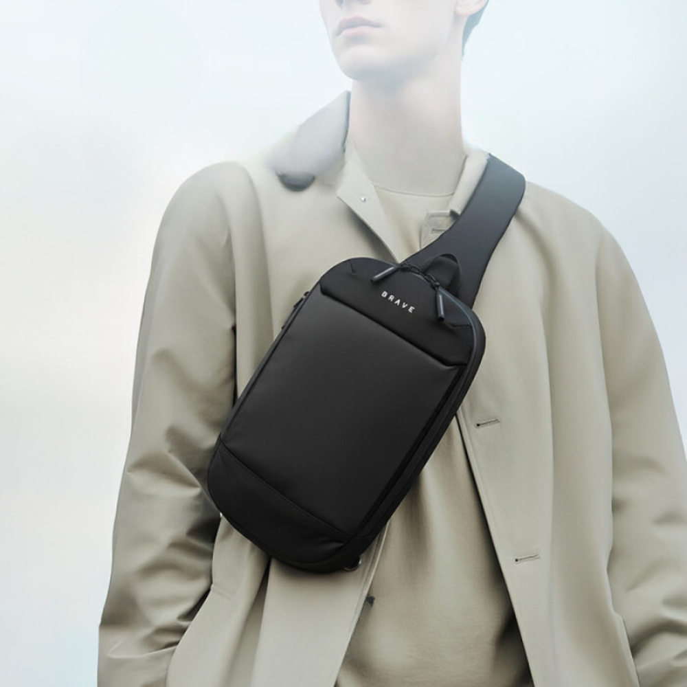 Black Brave sling bag worn diagonally on torso showing ergonomic fit and strap