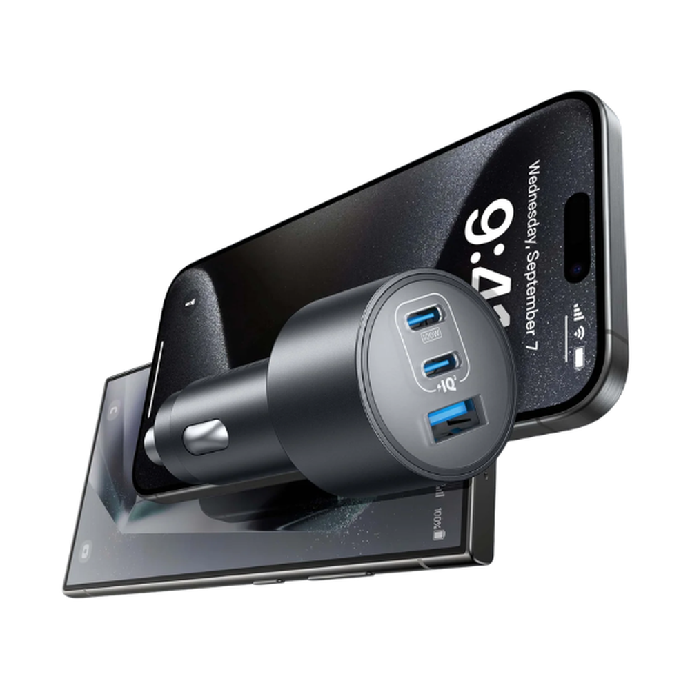 Black Anker car charger next to smartphone showing fast charging capability