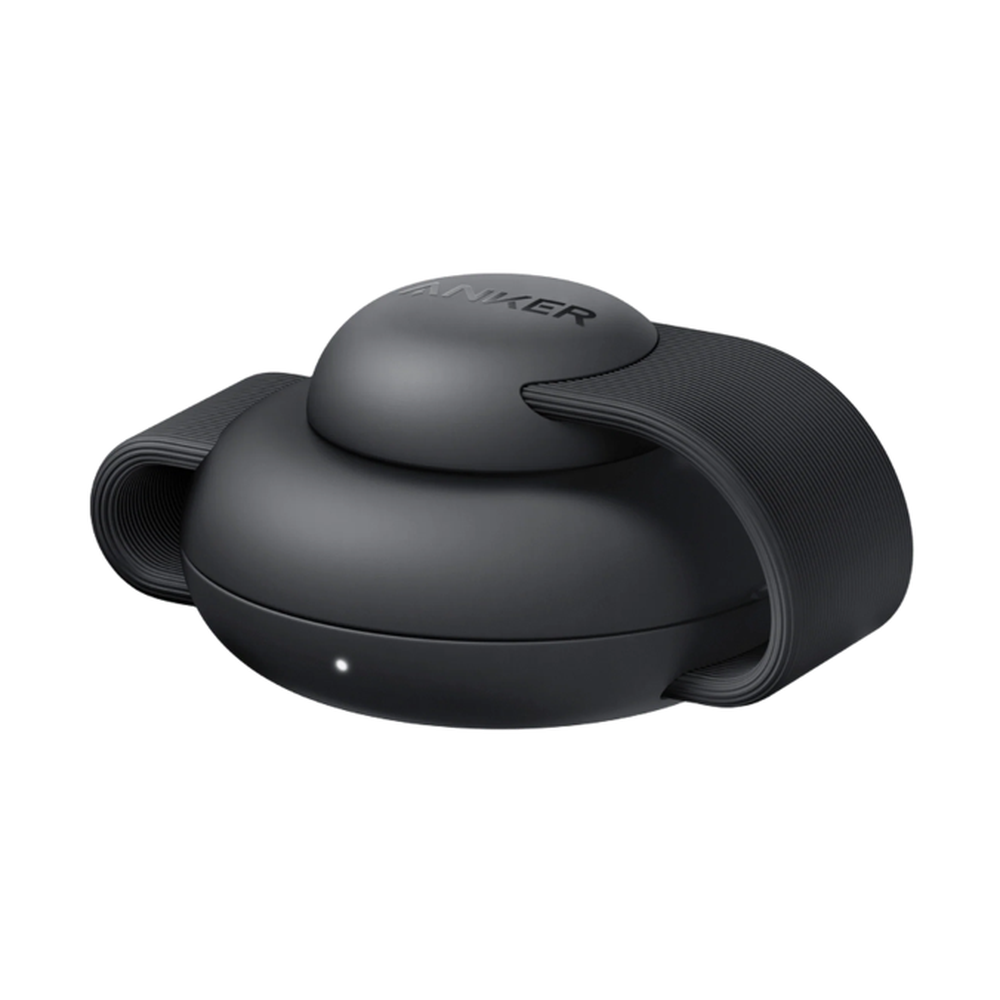 Close-up of black Anker 15W Qi2 wireless charger with ribbed strap and LED indicator