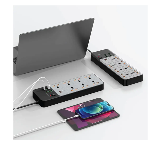 Porodo universal power strip charging laptop and smartphone with wireless pad on desk
