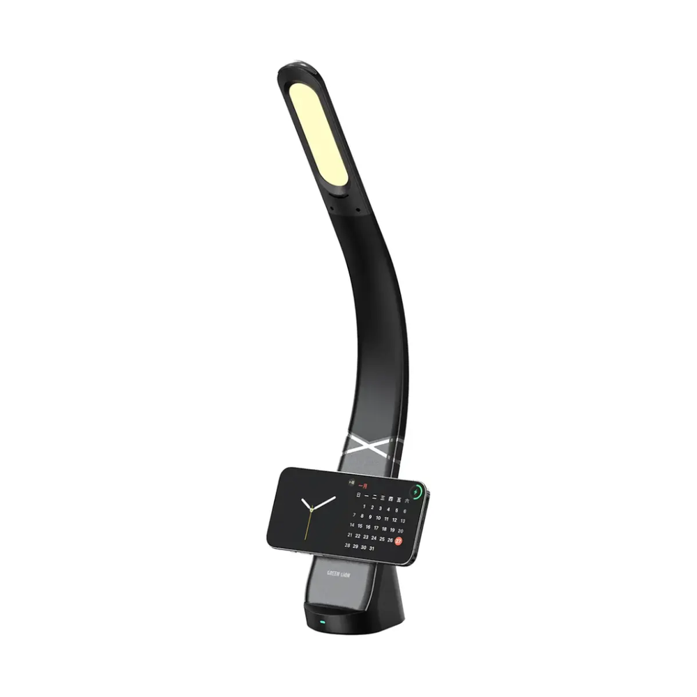 Green Lion LED desk lamp in warm light mode with horizontal smartphone mounted on wireless charging base