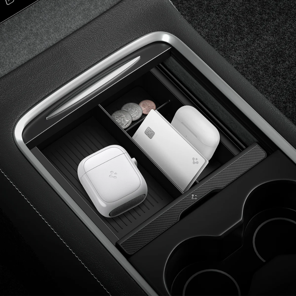 Spigen car screen cleaner stored in center console demonstrating compact size fit