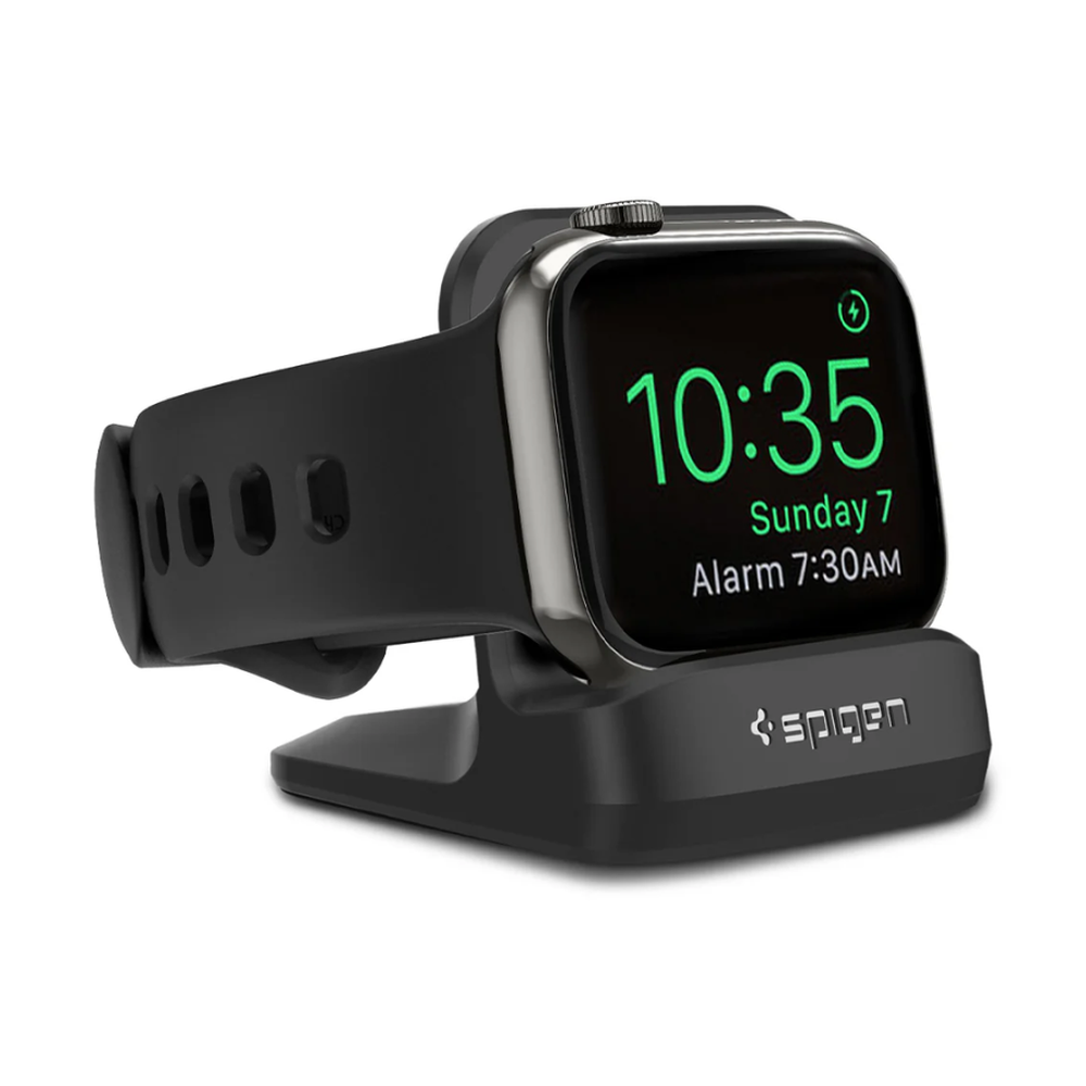 Black Spigen Apple Watch charging dock with visible band holes and green alarm display on screen