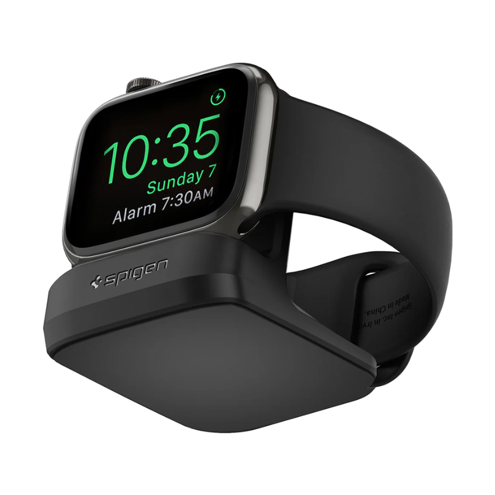 Close-up of black Spigen charging stand showing inner band text and secure cradle for Apple Watch