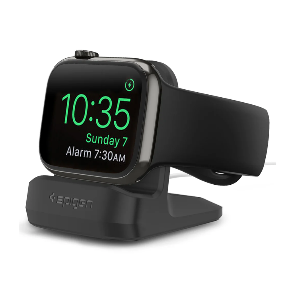 Spigen black charging dock displaying embossed logo and active charging screen on silver Apple Watch