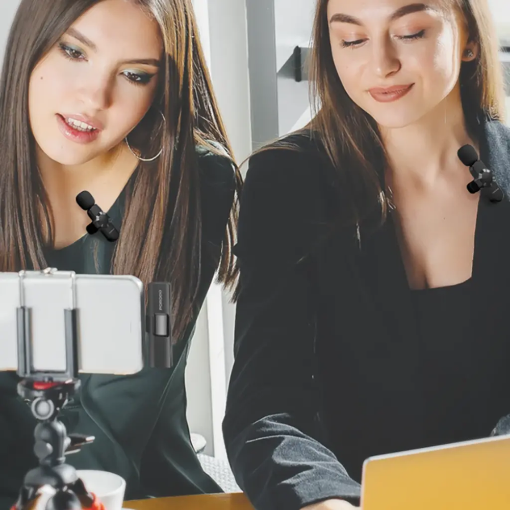 Women using black lavalier microphones for smartphone video recording