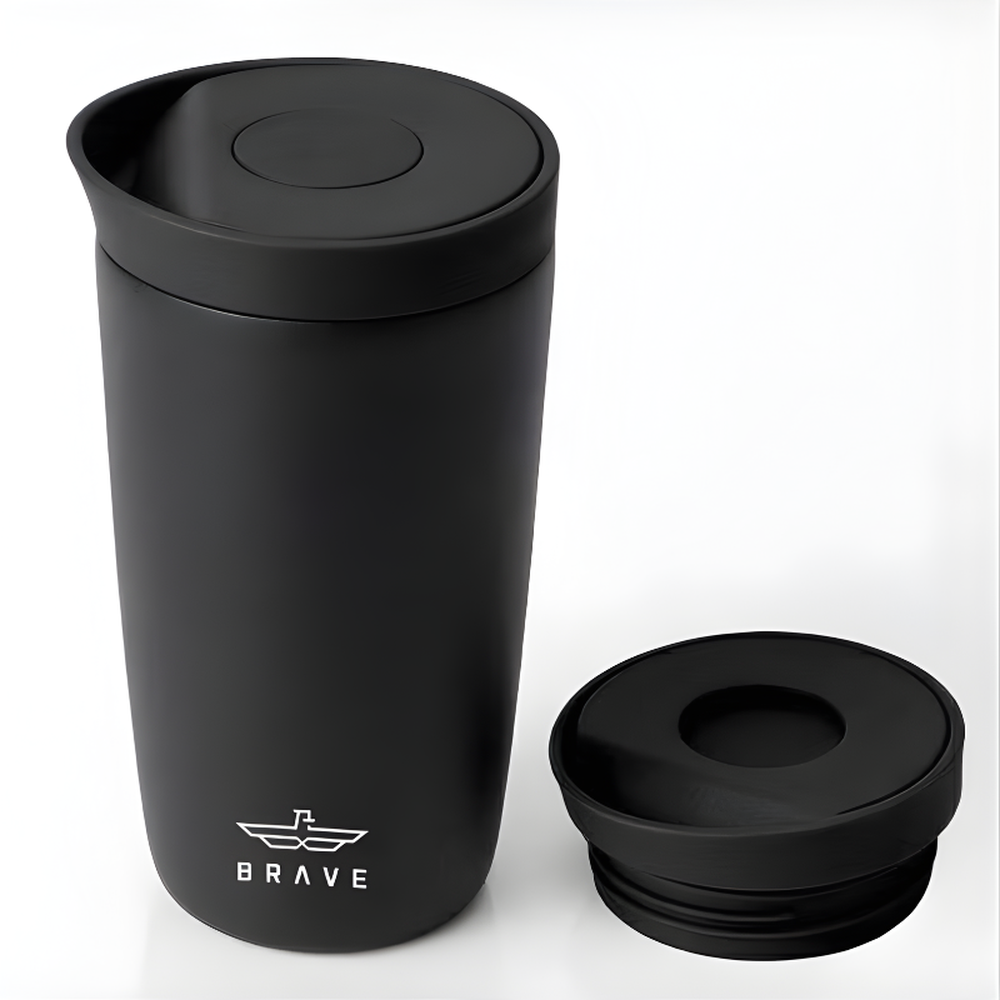 Brave matte black travel mug with winged logo and flip-top lid
