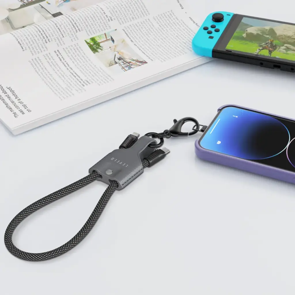 Levelo short charging cable attached to smartphone via carabiner for portable use