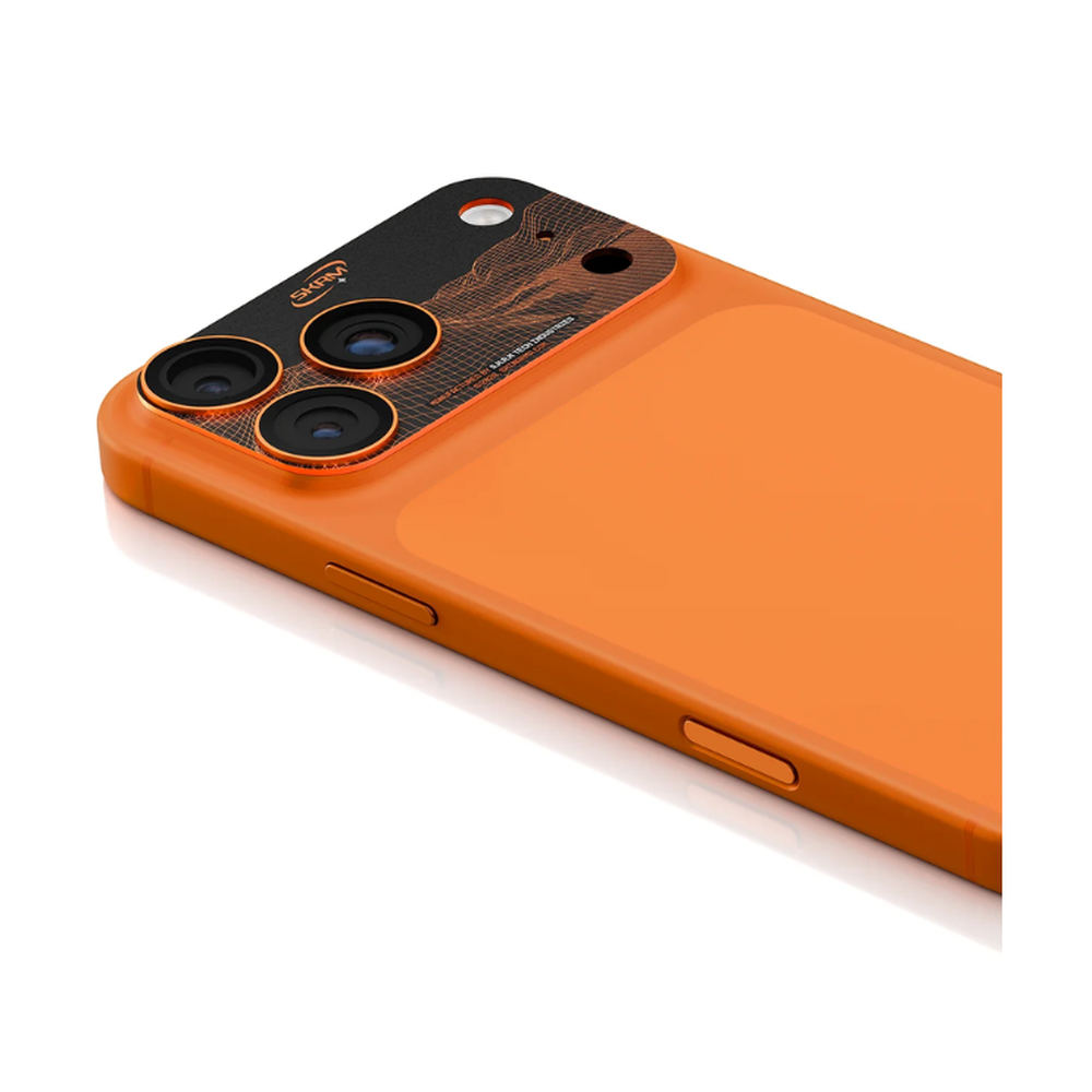 Orange iPhone 17 Pro Max with Skinarma aluminum camera lens protector featuring black grid top and orange border