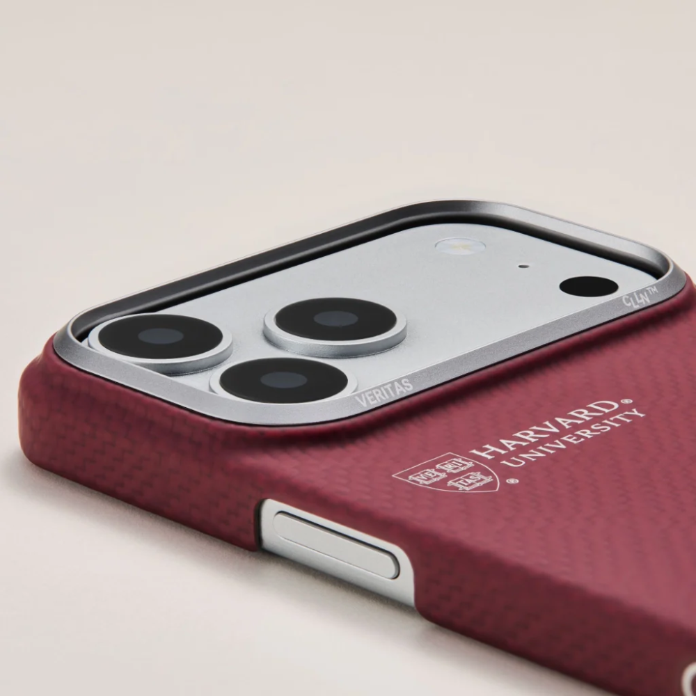 Close-up maroon phone case silver camera module frame with Veritas text