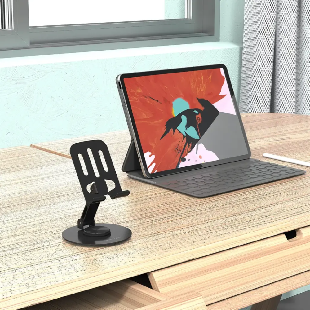 Black adjustable tablet stand on wood desk supporting device at viewing angle