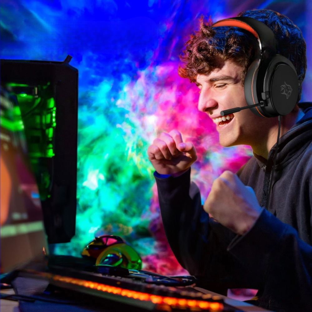 Celebrating gamer using Porodo RGB headset with noise-canceling microphone