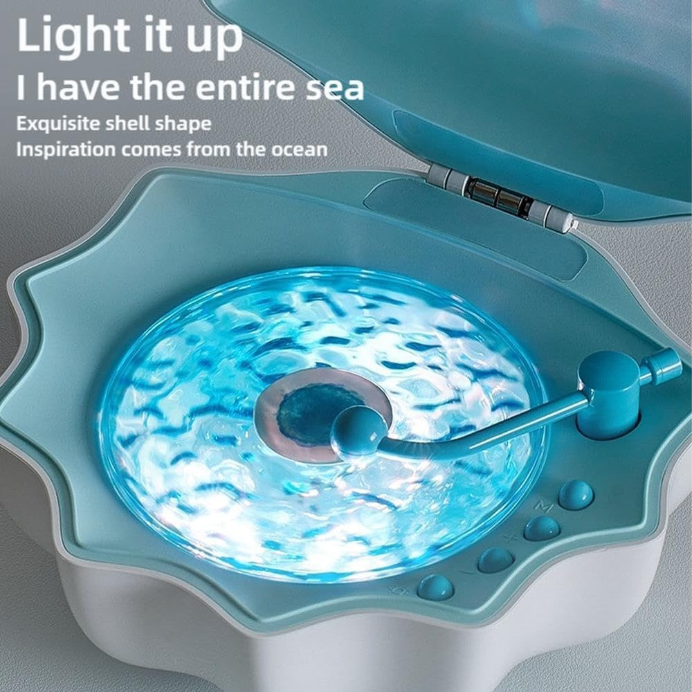 Mumqaq Night Wave Projector Speaker in light blue with ocean wave projection and vinyl needle design
